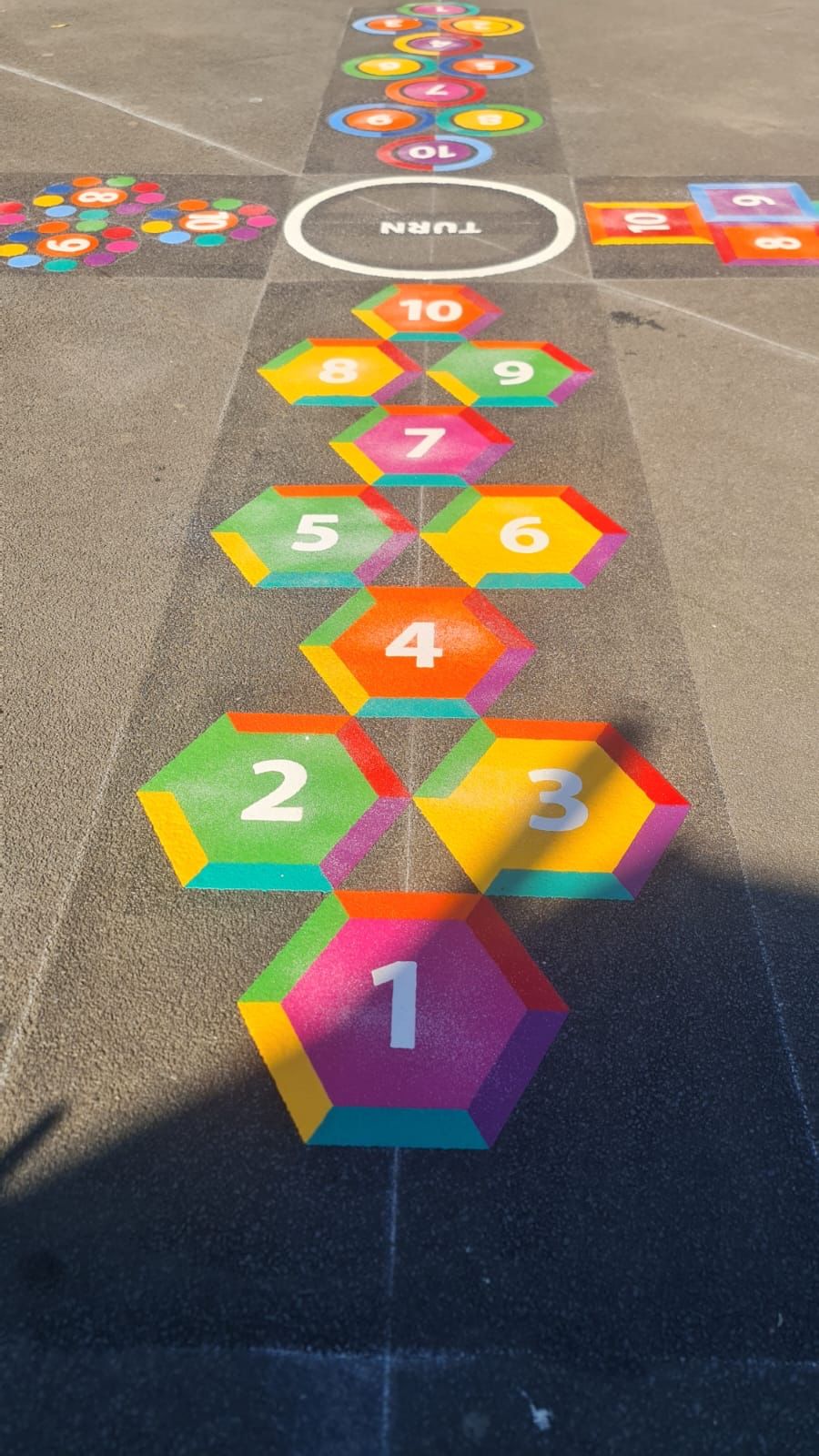 Hexagon &amp; trail hopscotch playground markings by Commercial Play